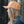 Hiking Boot, Trucker Hat worn by a woman outdoors, showcasing a stylish orange trucker hat designed in Canada.
