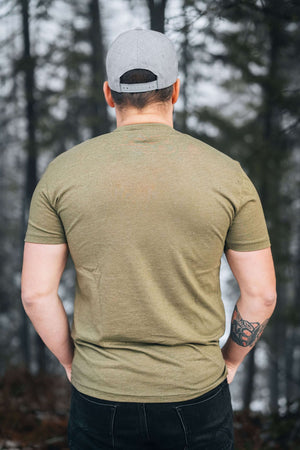 Bear and Mountain, Unisex T-shirt, Responsibly Made worn by a model in nature, showcasing eco friendly fabric.