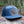 Hiking Boot, Flat Bill Hat with durable faux leather patch, crafted for outdoor adventures, designed in Canada.