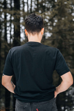 Forest Heart, Unisex T-shirt, Responsibly Made, model showcasing eco friendly t-shirt in a forest setting.