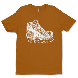 Hike More, Worry Less; Unisex T-shirt, Responsibly Made featuring outdoor illustrations on a brown tee.