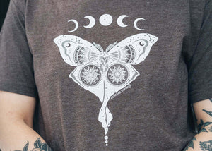 Luna Moth, Unisex T-shirt, Responsibly Made featuring original artwork of a moth and celestial designs.