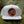 Moon and Climber Flat Bill Hat showcased on moss background, featuring faux leather patch and adjustable snapback.