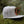 Moon and Climber Flat Bill Hat on mossy ground, perfect outdoor hat designed by a Canadian artist.