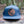 Moon and Climber Flat Bill Hat featuring durable faux leather patch in a natural setting.