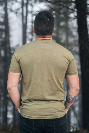 Moon and Climber, Unisex T-shirt, Responsibly Made worn by a man outdoors, showcasing eco friendly design by a Canadian artist.