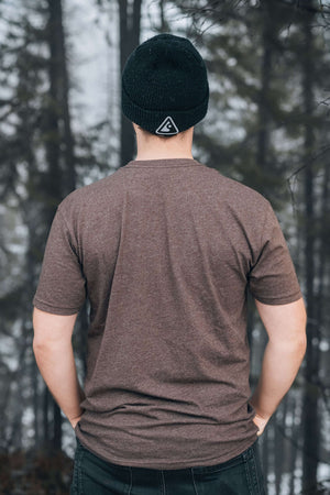 Roaming Bear, Unisex T-shirt, Responsibly Made - Back view of a man wearing a soft eco friendly tshirt in a forest.