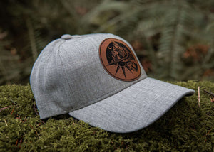 Sea to Sky Trucker Hat in grey with faux leather patch, perfect outdoor hat for women.