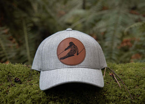 Skier, Trucker Hat with durable faux leather patch, perfect outdoor hat for women, designed in Canada.