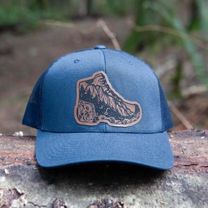 Hiking Boot, Trucker Hat featuring a durable faux leather patch and original Mountain Mornings illustrations designed in Canada.