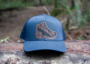 Hiking Boot, Trucker Hat featuring a durable faux leather patch and original Mountain Mornings illustrations designed in Canada.