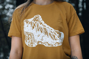 Hiking Boot, Unisex T-shirt, Responsibly Made featuring outdoor illustrations by a Canadian artist.