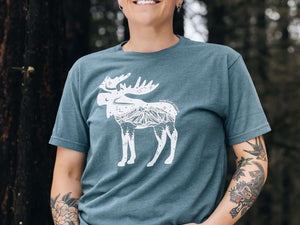 Moose, Unisex T-shirt, Responsibly Made worn by a model outdoors, showcasing premium apparel with outdoor illustrations.