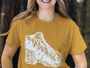 Hiking Boot, Unisex T-shirt, Responsibly Made showcasing original outdoor illustrations on eco-friendly fabric.