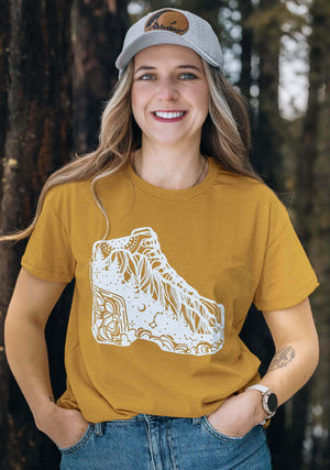 Hiking Boot, Unisex T-shirt, Responsibly Made showcasing original outdoor illustrations on eco-friendly fabric.
