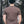 Back view of a man wearing a Wolf, Unisex T-shirt, Responsibly Made in a forest setting.