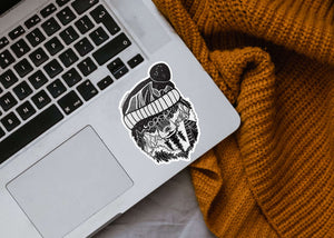 Winter Bear Sticker on a laptop, showing a black and white original illustration in glossy vinyl finish.