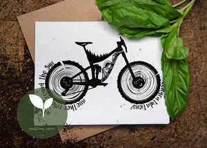 Another Ride Around the Sun, Plantable Seed Greeting Card featuring black and white illustration of a bicycle and basil leaves.