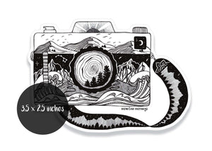 Camera Sticker featuring original black and white illustration by Canadian artist, durable vinyl for outdoor use.