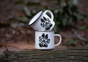 Dog Paw Enamel Mug - Stack of enamel mugs featuring original illustration, perfect for outdoor adventures.