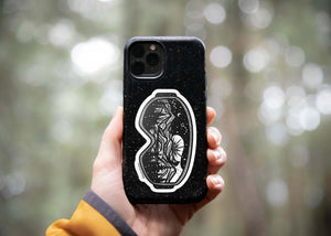 Goggles Sticker on a phone case, featuring a black and white original illustration. Durable vinyl outdoor sticker.