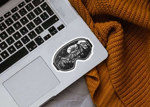 Goggles Sticker on laptop showing a black and white original illustration, made in Canada by a Canadian artist.