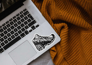 Hiking Boot Sticker on a laptop, showcasing an original illustration, perfect for outdoor decoration.