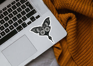 Luna Moth Sticker on a laptop, a glossy vinyl outdoor sticker with an original black and white illustration.