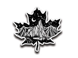Maple Leaf Sticker Dark showcasing an original illustration of mountains and stars, an outdoor vinyl sticker made in Canada.