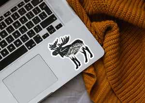 Moose Sticker on a laptop, a black and white permanent vinyl sticker by a Canadian artist.