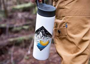 Mountain and Ocean Sticker on a water bottle, showcasing original illustration and outdoor vibes.