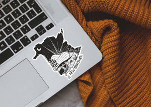 New Brunswick Sticker on a laptop, showcasing black and white original illustration, made in Canada.