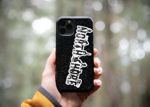 North Shore Sticker on a phone case, showcasing an outdoor sticker with a glossy vinyl finish.