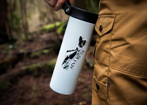 Nova Scotia Sticker on a travel mug held in a person's hand, designed by a Canadian artist, outdoor sticker.