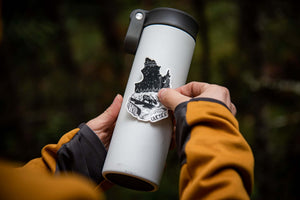 Quebec Sticker applied to a travel mug, showcasing original illustration by a Canadian artist.