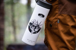 Sea to Sky Sticker on a white water bottle, showcasing black and white original illustration for outdoor use.