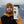 Man holding a travel mug featuring a Sea Wolf Sticker, an outdoor sticker with black and white original illustration.