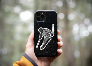 Skier Sticker on a phone case featuring original black and white illustration, perfect for outdoor enthusiasts.