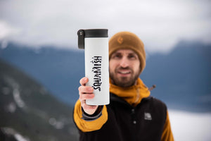 Squamish Sticker on a travel tumbler held by a man in a mountain setting, showcasing outdoor lifestyle.