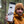Three Sisters Mountain Sticker on a travel mug held by an outdoor enthusiast in a forest.