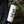 Tofino Sticker on a stylish travel mug outdoors, showcasing black and white original illustration by a Canadian artist.