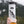 Vancouver Island Sticker on a travel mug in a mountain setting, featuring original black and white illustration.