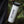 Vancouver Sticker on a reusable white travel mug held outdoors, showcasing an original black and white illustration.